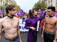 French comedian Marie Benoliel aka 'Marie S'Infiltre' (C) is seen during a protest to condemn violence against women, on November 23, 2019, in Paris. Alain JOCARD / AFP