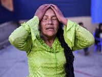 Bolivian wrestler Lidia Flores, aka "Dina, The Queen of the Ring", member of the Fighting Cholitas, gestures during a bout at Sharks of the Ring wrestling club in El Alto, Bolivia, on November 24, 2019. After a fortnight hiatus due to anti-government protests and blockades, the Fighting Cholitas are back in the ring. The unrest was triggered by the disputed October 20 election, which Evo Morales claimed to have won and opposition groups said was rigged. Ronaldo SCHEMIDT / AFP