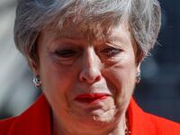 Britain's Prime Minister Theresa May reacts as she announces her resignation outside 10 Downing street in central London on May 24, 2019. Beleaguered British Prime Minister Theresa May announced on Friday that she will resign on June 7, 2019 following a Conservative Party mutiny over her remaining in power. Tolga AKMEN / AFP
