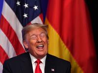 US President Donald Trump gestures during a bilateral meeting with German Chancellor Angela Merkel on the sidelines of the NATO summit at the Grove hotel in Watford, northeast of London on December 4, 2019. Nicholas Kamm / AFP