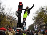 Protesters take part in a demonstration against the pension overhauls, on Place de la Nation in Paris, on December 5, 2019, as part of a national general strike. Trains cancelled, schools closed: France scrambled to make contingency plans on for a huge strike against pension overhauls that poses one of the biggest challenges yet to French President's sweeping reform drive. Alain JOCARD / AFP