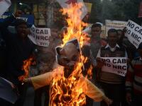 Protests against a divisive new citizenship law raged on December 14 as Washington and London issued travel warnings for northeast India following days of violent clashes that have killed two people so far. DIPTENDU DUTTA / AFP