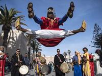 A Gnawa traditional group performs in the city of Essaouira on December 14, 2019, to celebrate the decision of adding the Gnawa culture to UNESCO's list of Intangible Cultural Heritage of Humanity. Gnawa culture, a centuries-old Moroccan practice rooted in music, African rituals and Sufi traditions, was added to UNESCO's list of Intangible Cultural Heritage of Humanity earlier in the week. FADEL SENNA / AFP