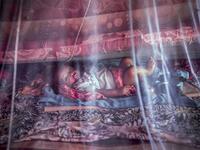 A displaced baby, who was forced to leave his house with his family due to heavy rains and floods in the area, rests under a mosquito net at a displacement camp for families affected by floods located in Beledweyne, Somalia, on December 14, 2019. The rains have inundated big areas surrounding Beledweyne area forcing thousands of people to leave their houses and look for humanitarian assistance while living in displacement camps. Due to climate change and human activities, floods have become more recurrent a