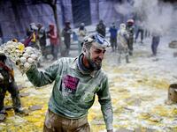 The Els Enfarinats festival takes place every year in Spain and sees two groups of residents cover each other and the entire town white with egg and flour (Twitter)