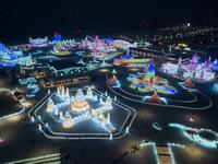 An aerial view shows ice sculptures illuminated ahead of the opening of the Harbin International Ice and Snow Festival in Harbin, in China's northeast Heilongjiang province on January 3, 2020. NOEL CELIS / AFP