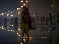 A Hindu devotee walks towards the festival area during the Gangasagar Mela, at Sagar Island, some 150 kilometres south of Kolkata on January 14, 2020. XAVIER GALIANA / AFP