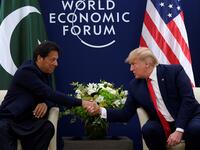 US President Donald Trump (R) shakes hands with Pakistani Prime Minister Imran Khan ahead of their meeting at the World Economic Forum in Davos, on January 21, 2020. JIM WATSON / AFP
