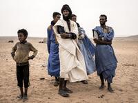 Young men from the small Nemadi(hunters) tribe in Eastern Mauritania are seen in the Loudeyatt Nemadi Camp on January 23, 2020. In the arid West African country of Mauritania, the way of life of the traditional group of hunters known as the Nemadi is slowly disappearing. JOHN WESSELS / AFP