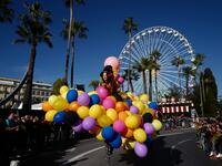 A participant in fancy dress takes part in the 136th Nice Carnival parade which celebrates this year the 'Fashion King' in Nice, southeastern France, on February 15, 2020. The carnival runs from February 15 to February 29, 2020. VALERY HACHE / AFP