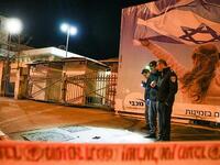 Israeli policemen inspect the site of a car-ramming attack carried out by a Palestinian in Jerusalem in the early hours of this morning  (AFP)