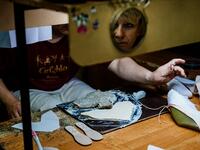 An employees of Grishko company produces pointe shoes in the company's Moscow workshop on February 25, 2020. Born in the chaos of the collapse of the Soviet Union, the Grishko family business has emerged among the top makers in the world of dance shoes, notably classic ballet pointe shoes, worn on the world's great stages. Dimitar DILKOFF / AFP