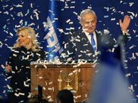 Israeli Prime Minister Benjamin Netanyahu and his wife Sara address supporters as confetti falls upon them at the Likud party campaign headquarters in the coastal city of Tel Aviv early on March 3, 2020, after polls officially closed. Netanyahu claimed "a giant victory" in elections on March 3, boasting that his right-wing Likud party had defied "all expectations" in the country's third vote in less than a year. After exit polls by three networks forecast that Likud and its allies were on track to win 59 pa