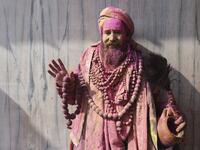 A sadhu (Hindu holy man) gestures to the camera during Holi celebrations, the spring festival of colours, in Nandgaon village in Uttar Pradesh state on March 5, 2020. Holi is observed in India at the end of the winter season on the last full moon of the lunar month. Money SHARMA / AFP