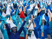 People dressed as Smurfs ('Schtroumpfs' in French), a Belgian comic franchise centered on a fictional colony of small, blue, human-like creatures who live in mushroom-shaped houses in the forest, attend a world record gathering of Smurfs on March 7, 2020, in Landerneau, western France. Damien MEYER / AFP
