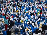 People dressed as Smurfs ('Schtroumpfs' in French), a Belgian comic franchise centered on a fictional colony of small, blue, human-like creatures who live in mushroom-shaped houses in the forest, attend a world record gathering of Smurfs on March 7, 2020, in Landerneau, western France. Damien MEYER / AFP
