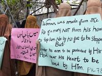 Burqa-clad female activists of Islamic political party Jamiat Ulema-e-Islam (JUI-F), carry placards during a rally to mark the International Women's Day in Peshawar on March 8, 2020. Thousands of people are expected to rally in cities across Pakistan on March 8 to mark International Women's Day in an ultra-conservative society where women are still put to death under ancient "honour" codes. Abdul MAJEED / AFP