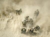 In this file photo taken on August 23, 2011, US soldiers gather near a destroyed vehicle and protect their faces from rotor wash, as their wounded comrades are airlifted by a Medevac helicopter from the 159th Brigade Task Force Thunder to Kandahar Hospital Role 3. American forces have started pulling out of two bases in Afghanistan, a US official said on March 10, 2020 the day peace talks between Kabul and the Taliban were due to start despite widespread violence and a political crisis. The United States is
