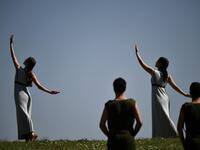 Participants dressed in ancient attire take part in the Olympic flame lighting ceremony in ancient Olympia, on March 12, 2020 ahead of Tokyo 2020 Olympic Games. ARIS MESSINIS / AFP