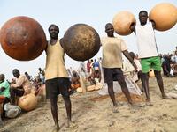 Fishermen carry calabashes to attend Argungu fishing and cultural festival at Argungu Town, Kebbi State in northwestern Nigeria, on March 14, 2020. Argungu fishing and cultural festival is one of the oldest and most widely attended festivals in the country dating back many generations, featuring series of water competitions and traditional games. The festival returned after 10 years suspension due to insecurity in northwest Nigeria. PIUS UTOMI EKPEI / AFP