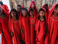 Wayuu girls prepare to perform the traditional La Yonna dance, in Tres Bocas, northern Colombia, on March 13, 2020. Juan BARRETO / AFP
