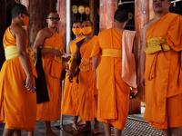 Buddhist monks wear face masks amid concerns over the spread of the COVID-19 coronavirus at Wat Pak Nam Buddhist temple in Bangkok on March 16, 2020. Lillian SUWANRUMPHA / AFP