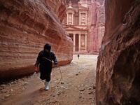A labourer sprays disinfectant in Jordan's archaeological city of Petra south of the capital Amman on March 17, 2020, to prevent the spread of COVID-19. Khalil MAZRAAWI / afp