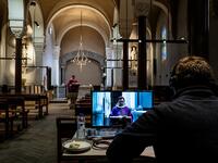 Auxiliary bishop of Lyon Emmanuel Gobilliard holds a streamed live Mass in the empty Saint-Irenee church, in Lyon, on March 24, 2020, on the eighth day of a lockdown aimed at curbing the spread of the virus. JEFF PACHOUD / AFP