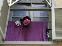 A Minnie Mouse stuffed toy dangles from a window as families are confined at home amid the COVID-19 pandemic crisis, in the historic part of the southern coastal city of Sidon (Saida), on April 6, 2020. Lebanon's President called on international donors to provide financial assistance to the crisis-hit country as it grapples with a severe economic downturn compounded by the novel coronavirus pandemic. JOSEPH EID / AFP