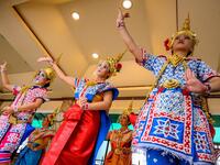 Traditional Thai dancers wearing protective face shields perform at the Erawan Shrine, which was reopened after the Thai government relaxed measures to combat the spread of the COVID-19 novel coronavirus, in Bangkok on May 4, 2020. Thailand began easing restrictions related to the COVID-19 novel coronavirus on May 3 by allowing various businesses to reopen, but warned that the stricter measures would be re-imposed should cases increase again. Mladen ANTONOV / AFP