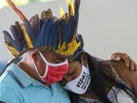 Indigenous from the Parque das Tribos community mourns at the funeral of Chief Messias, 53, of the Kokama tribe who died victim of the new coronavirus, COVID-19, in Manaus, Brazil, on May 14, 2020. MICHAEL DANTAS / AFP