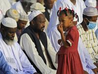 Muslim worshippers gather for the prayers of Eid al-Fitr, the Muslim holiday which starts at the conclusion of the holy fasting month of Ramadan, in the district of Jureif Gharb of Sudan's capital Khartoum early on May 24, 2020, despite government regulations banning congregations due to the COVID-19 coronavirus pandemic. Ashraf SHAZLY / AFP