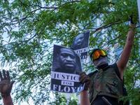 Protesters gather in a call for justice for George Floyd, a black man who died after a white policeman kneeled on his neck for several minutes, at Hennepin County Government Plaza, on May 28, 2020 in Minneapolis, Minnesota. kerem yucel / AFP
