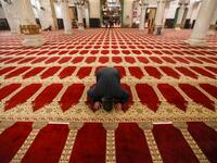 A Palestinian man performs the morning prayer inside Al-Aqsa mosque, before the start of the dawn prayer (salat al-fajr) in Jerusalem's Old City, on May 31, 2020, after a two-month closure due to the COVID-19 pandemic. AHMAD GHARABLI / AFP