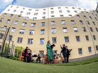 Guests of Zeitgeist Hotel listen from their rooms to singers Monika Medek and Dagmar Dekanovsky and the Camerata Carnutum orchestra, during a window concert (Fensterkonzert) in Vienna on May 30, 2020, as hotels have reopened in Austria amid the novel coronavirus pandemic. JOE KLAMAR / AFP