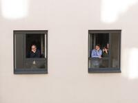 Guests of Zeitgeist Hotel listen from their rooms to singers Monika Medek and Dagmar Dekanovsky and the Camerata Carnutum orchestra, during a window concert (Fensterkonzert) in Vienna on May 30, 2020, as hotels have reopened in Austria amid the novel coronavirus pandemic. JOE KLAMAR / AFP