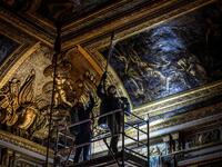 An employee wearing a protective face mask cleans the Queen's grand appartment at the Chateau de Versailles (Palace of Versailles) in Versailles near Paris, on June 5, 2020 on the eve of it re-opening after 82 days of closure due to the novel coronavirus (COVID-19) outbreak. The Palace of Versailles -- France's big tourist attraction with nearly 10 million tourists a year - will open on June 6 with no US or Asia tourists who represent 30% of its visitors. STEPHANE DE SAKUTIN / AFP