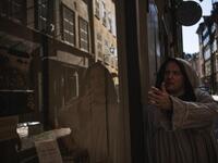 Tour guide Mike Anderson takes visitors on May 30 ,2020 on a 'plague walk', taking them around sites in Stockholm's old town related to pandemics of the plague in the 14th and 18th century, and an outbreak of cholera that hit the city in the mid-19th century. Jonathan NACKSTRAND / AFP