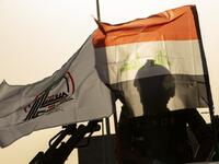 Members of the Hashed al-Shaabi (Popular Mobilisation) paramilitary force take part in a military parade in the southern Iraqi city of Basra on June 14, 2020, marking the sixth anniversary of its founding after Iraq's top Shiite cleric Grand Ayatollah Ali Sistani called to defend the country from the Islamic State group (IS). Hussein FALEH / AFP