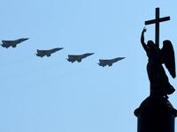 Russian military jets fly over Dvortsovaya Square during a military parade, which marks the 75th anniversary of the Soviet victory over Nazi Germany in World War Two, in Saint Petersburg on June 24, 2020. The parade, usually held on May 9, was postponed this year because of the coronavirus pandemic. OLGA MALTSEVA / AFP