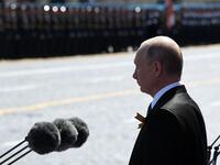 Russian President Vladimir Putin and guests observe a minute of silence during a military parade, which marks the 75th anniversary of the Soviet victory over Nazi Germany in World War Two, at Red Square in Moscow on June 24, 2020. The parade, usually held on May 9, was postponed this year because of the coronavirus pandemic. Alexey NIKOLSKY / SPUTNIK / AFP