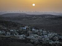 A picture taken from the Israeli settlement of Naale in the occupied West Bank northwest of the Palestinian city of Ramallah shows the skyline of the Israeli coastal city of Tel Aviv on June 17, 2020. The government of Israeli Prime Minister Benjamin Netanyahu has said it could begin the process to annex Jewish settlements in the West Bank as well as the strategic Jordan Valley from July 1. The plan -- endorsed by Washington -- would see the creation of a Palestinian state, but on reduced territory, and wit