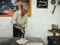 In the green hills of Deir Mama, Saud, his wife and three sons have been making silk for decades. They would raise silk worms in the spring, watching them munch on mulberry tree leaves and slowly build their thick cocoons, before spinning the thread and weaving those coils into fine cloth. MAHER AL MOUNES / AFP