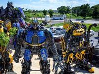This photograph taken on July 18, 2020 shows life-sized sculptures of characters from the "Transformers" film franchise made of scrap metal parts at the Ban Hun Lek museum in Ang Thong, some 100km north of Bangkok. "Ban Hun Lek" or "The House of Steel Robots" is a museum where a collective of artists display their scrap metal creations depicting popular comics and sci-fi film characters. Mladen ANTONOV / AFP
