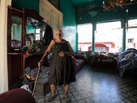 Rose Ghoulam, 90-years-old, stands in her damaged house in the damaged neighbourhood Gemmayze in the Lebanese capital Beirut on August 6, 2020, two days after a massive explosion shook the Lebanese capital. The blast, which appeared to have been caused by a fire igniting 2,750 tonnes of ammonium nitrate left unsecured in a warehouse, was felt as far away as Cyprus, some 150 miles (240 kilometres) to the northwest. The scale of the destruction was such that the Lebanese capital resembled the scene of an eart