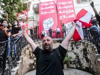 Lebanese protesters gather in the courtyard of the Ministry of Foreign Affairs in Beirut on August 8, 2020, after they stormed the headquarters as anger exploded over a deadly blast that made hundreds of thousands homeless and shocked the world. STR / AFP