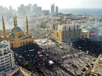 This picture taken on August 8, 2020 shows an aerial view of clashes between demonstrators and security forces, in downtown Beirut on August 8, 2020, following a demonstration against a political leadership they blame for a monster explosion that killed more than 150 people and disfigured the capital Beirut. AFP