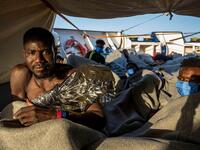 Appealing for help, Lea Reisner, head of operations for the Louise Michel, said: 'The people have sat in a mix of salt water and fuel for days' (AFP)