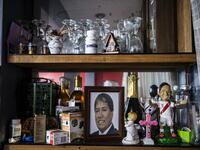 View of a photo of Peruvian Ernesto Diaz, 55, who died from COVID-19 virus on a shelf of his home in Chorrillos, south of Lima, Peru on August 11, 2020. Global deaths from the coronavirus have almost reached on September 25, 2020 the grim threshold of one million. Around one-third of fatalities were in Latin America, where countries with overstretched medical resources are preparing for a further onslaught. ERNESTO BENAVIDES / AFP