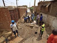 On Tuti Island, the highest Nile waters since records began a century ago have left people struggling to build dams by filling bags with sand and small stones to stem the flood. ASHRAF SHAZLY / AFP